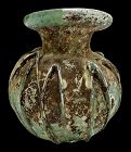 A ROMAN GLASS JAR WITH APPLIED TRAILING