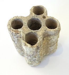 AN EGYPTIAN LIMESTONE QUINTUPLE KOHL TUBE