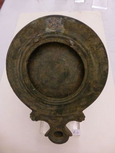 A ROMAN BRONZE OIL LAMP