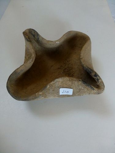 A MIDDLE BRONZE AGE TERRACOTTA OIL LAMP