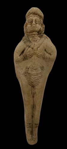 AN ELAMITE TERRACOTTA FEMALE FIGURE